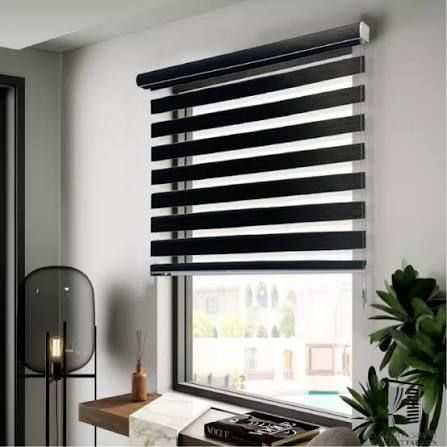 Black day-and-night zebra blind on a window